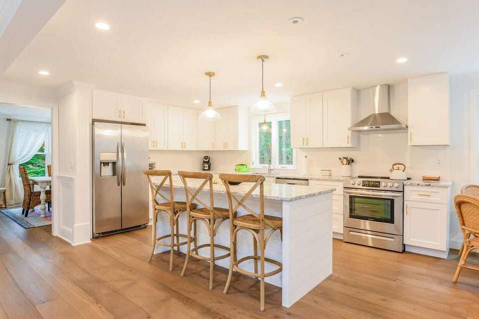 Kitchen with breakfast bar and all stainless appliances