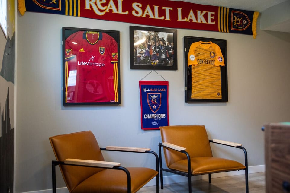 Game Room – Sports fan lounge with jersey wall. 5 minutes away from Rio Tinto Stadium