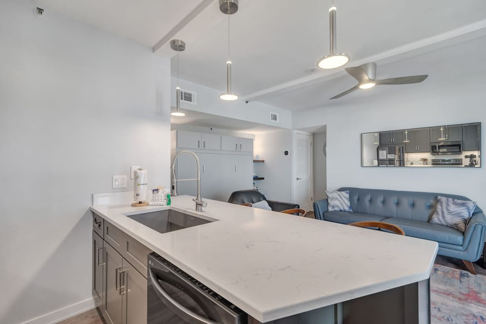 The kitchen breakfast bar offers ample counter space and casual dining. Perfect for meal prep, entertaining, and socializing.