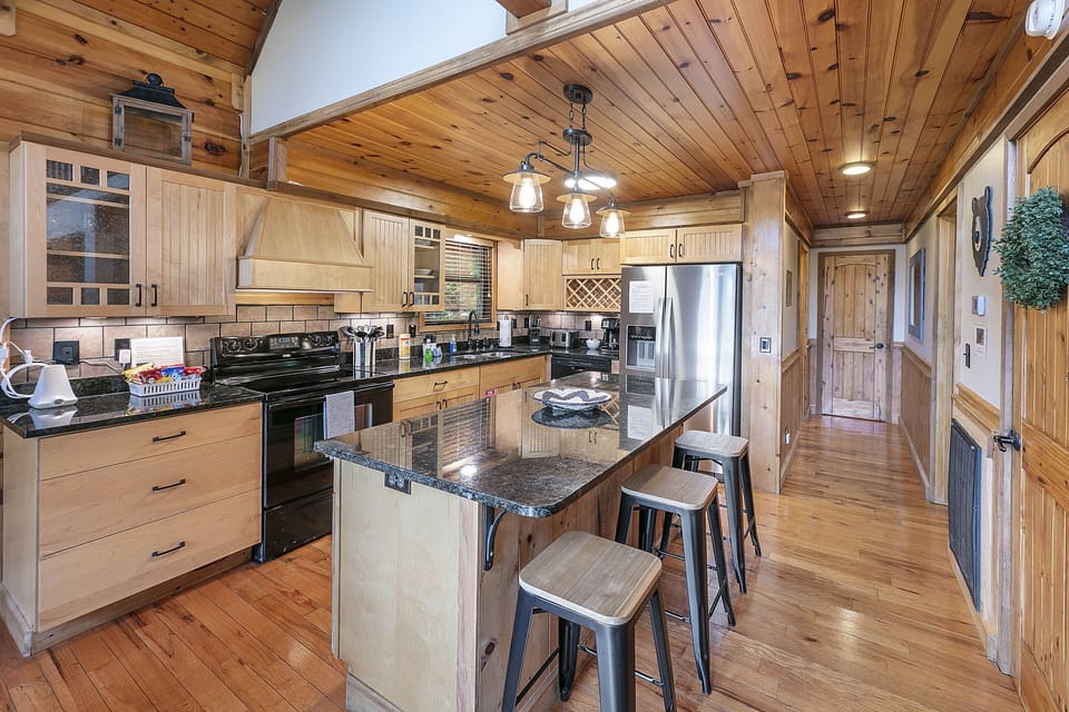 Fully stocked gourmet kitchen with island and large pantry