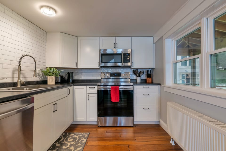 Full kitchen with stainless steel appliances