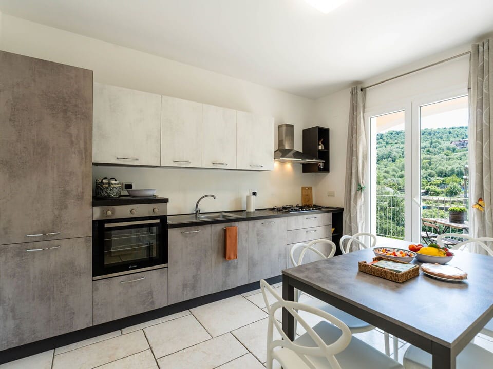 Kitchen, Kitchen Appliance, Countertop, Furniture, Major Appliance, Interior Design, Flooring, Cabinetry, Wood, Home Appliance