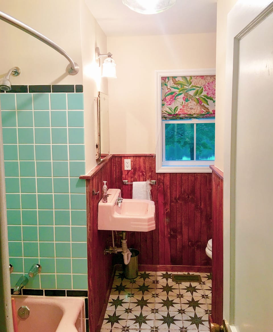 Original bath with pink sink and tub.