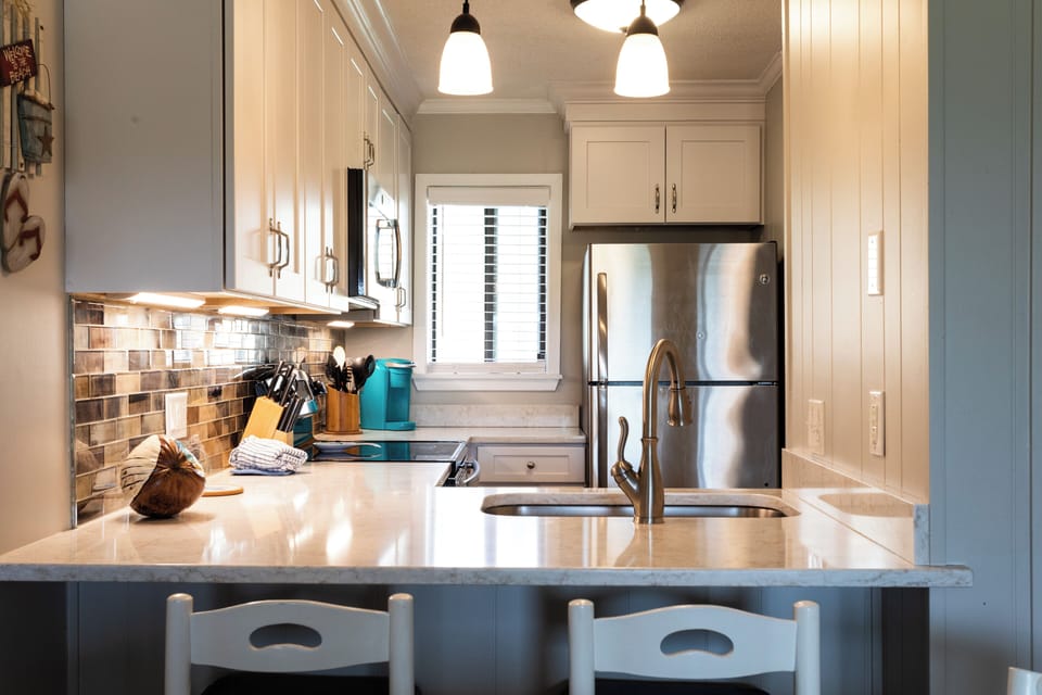 Enjoy the upgraded kitchen with quartz countertops & stainless steel appliances