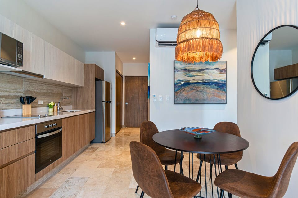 Cook a savory meal in our full kitchen with granite countertops, and let the fresh air from the open balcony doors add to the experience