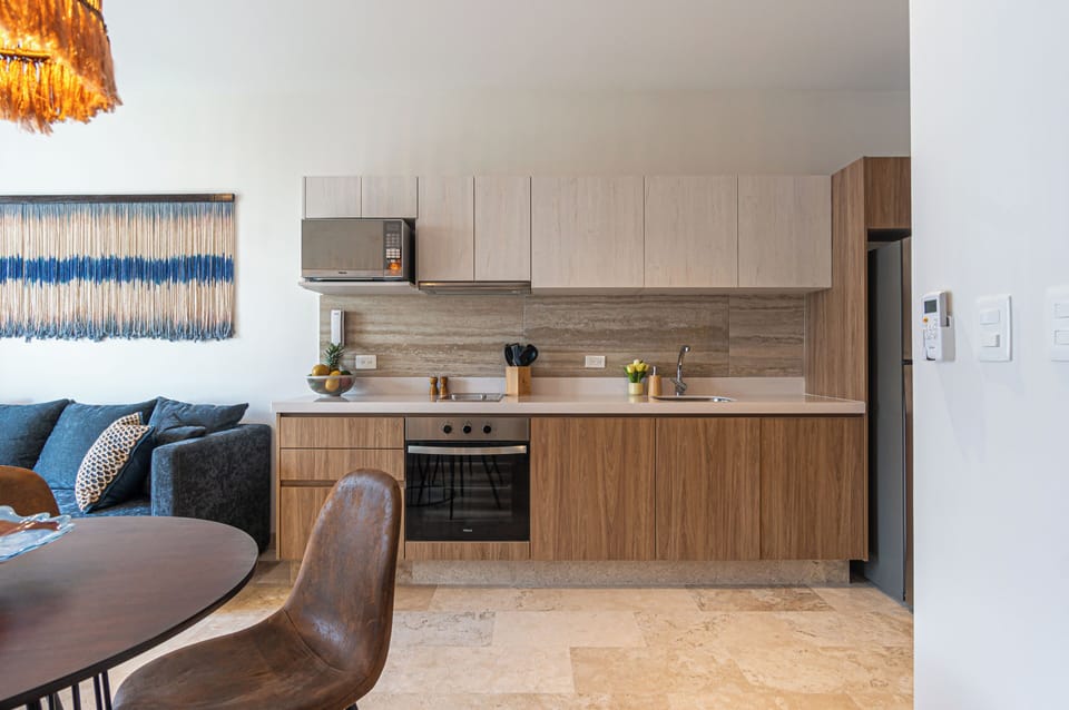 Cook a savory meal in our full kitchen with granite countertops, and let the fresh air from the open balcony doors add to the experience