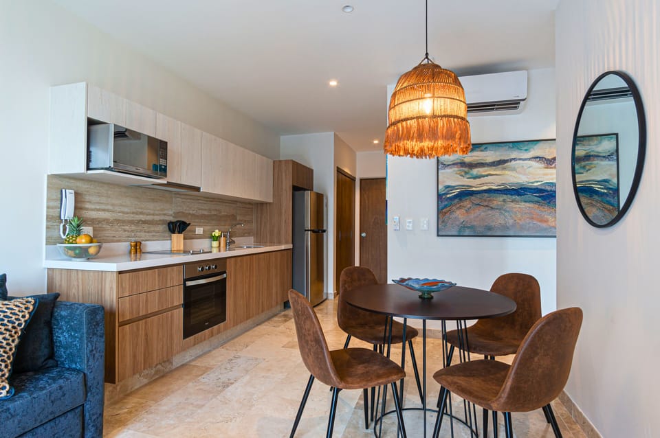 Cook a savory meal in our full kitchen with granite countertops, and let the fresh air from the open balcony doors add to the experience