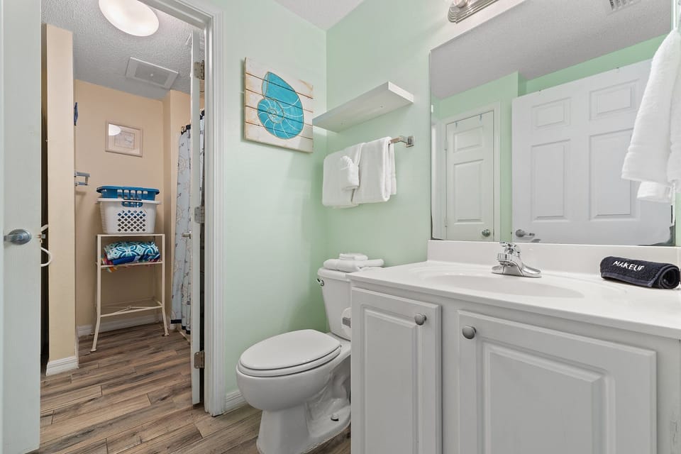 1/2 bath - connected to full bath and laundry area. 