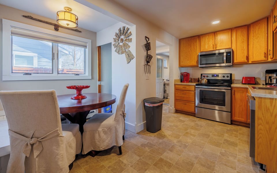 The kitchen with modern appliances and a cozy dining nook