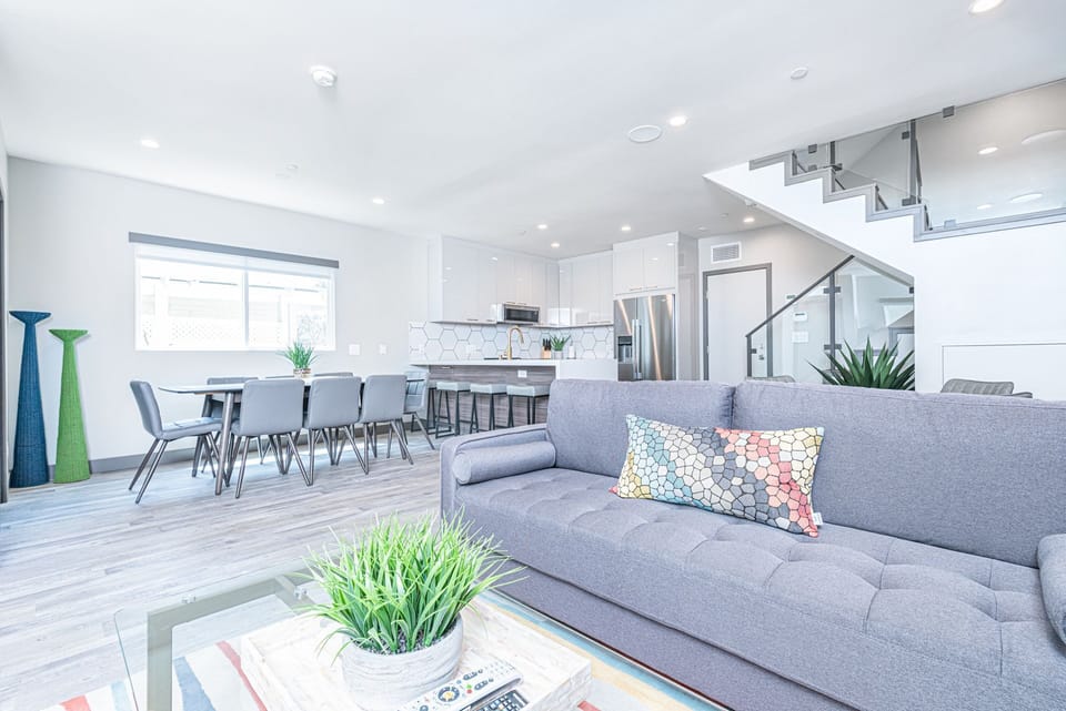 Bright, open-concept living space with modern finishes and seamless flow to the dining and kitchen areas
                