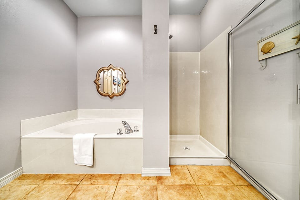 Master bath with Garden tub and separate shower. Great water pressure.