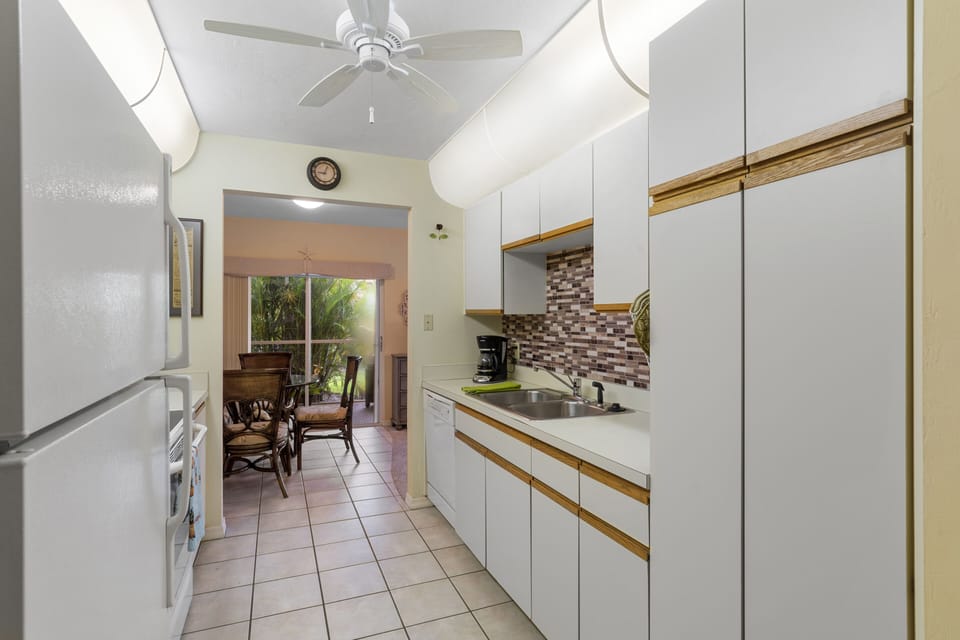 Bright and cheerful kitchen. Kitchen has new stainless steel fridge / microwave