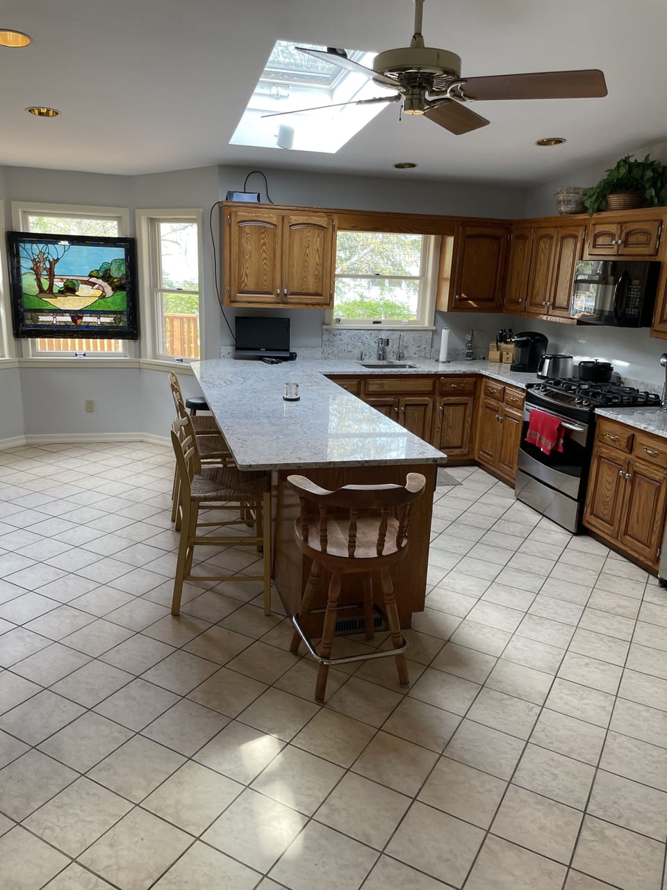 Large chefs kitchen with plenty of seating on stools 