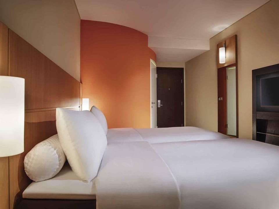 Standard Room, 2 Twin Beds, City View | In-room safe, desk, laptop workspace, blackout drapes