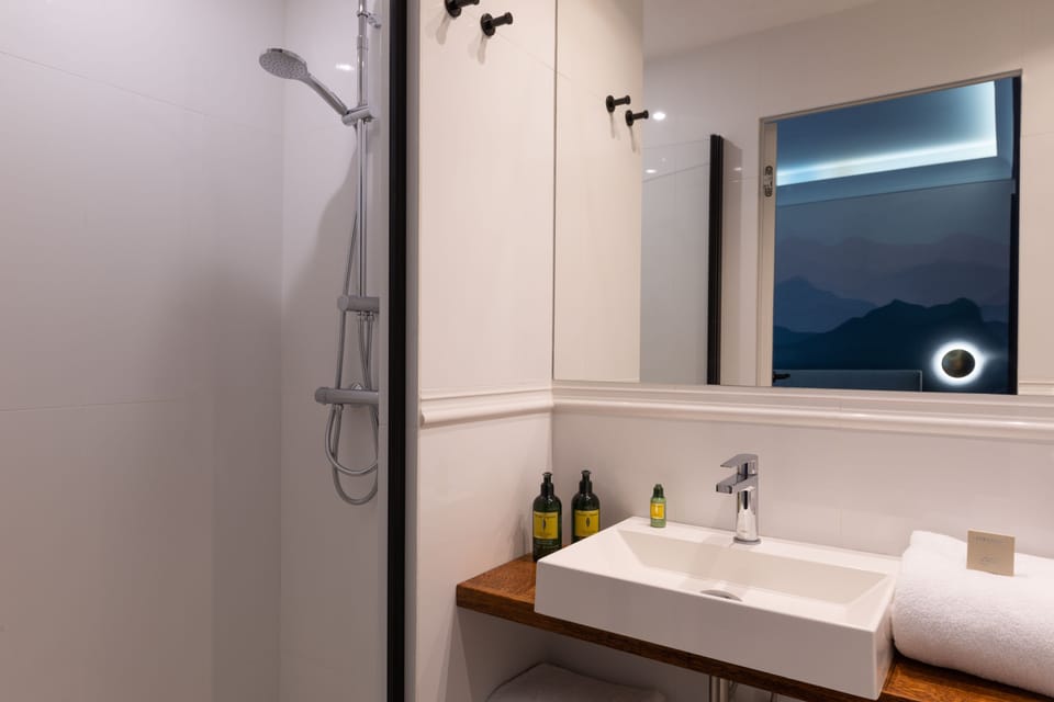 Shower, rainfall showerhead, designer toiletries, hair dryer