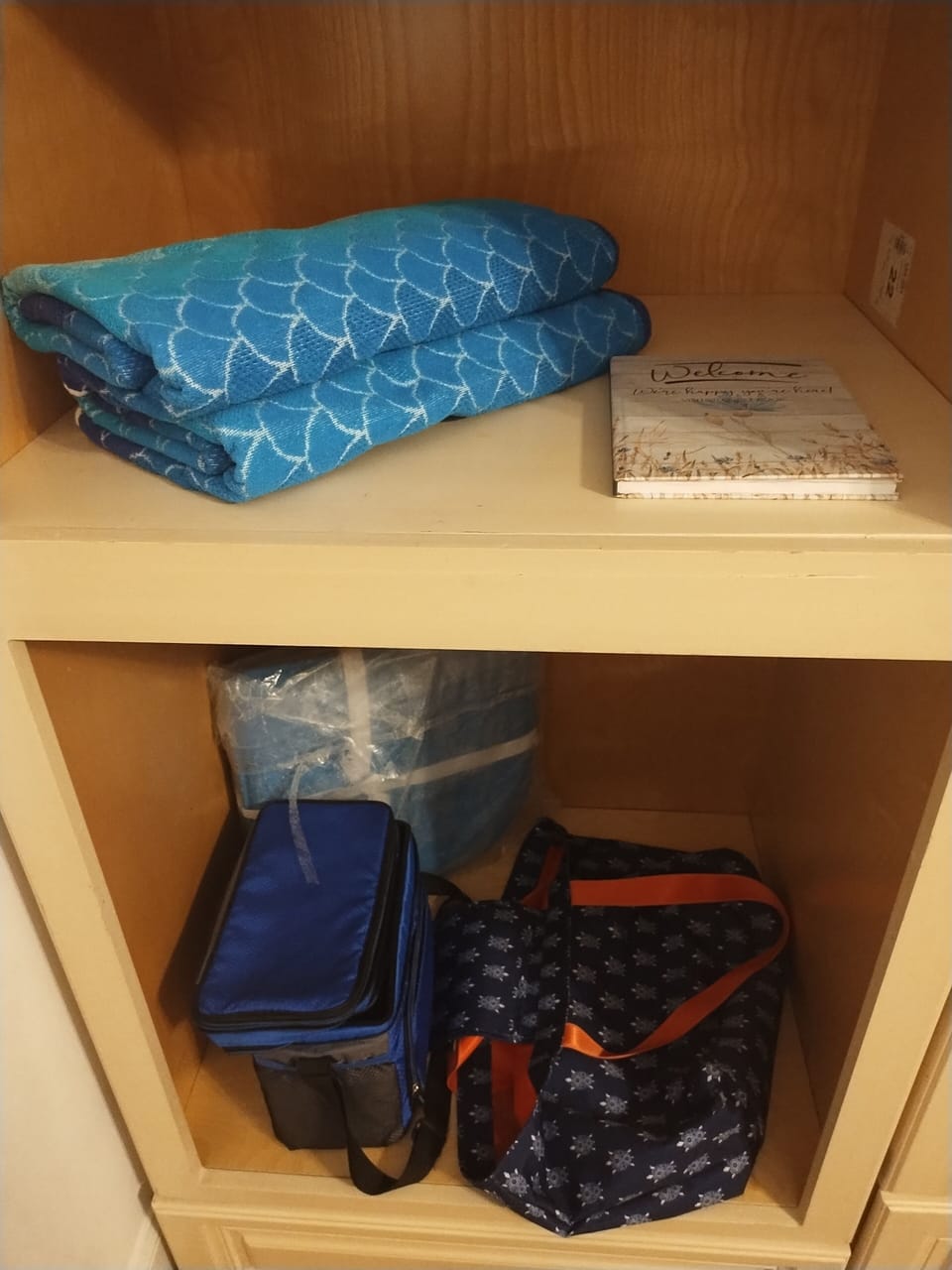 small cooler, beach bag and beach towels