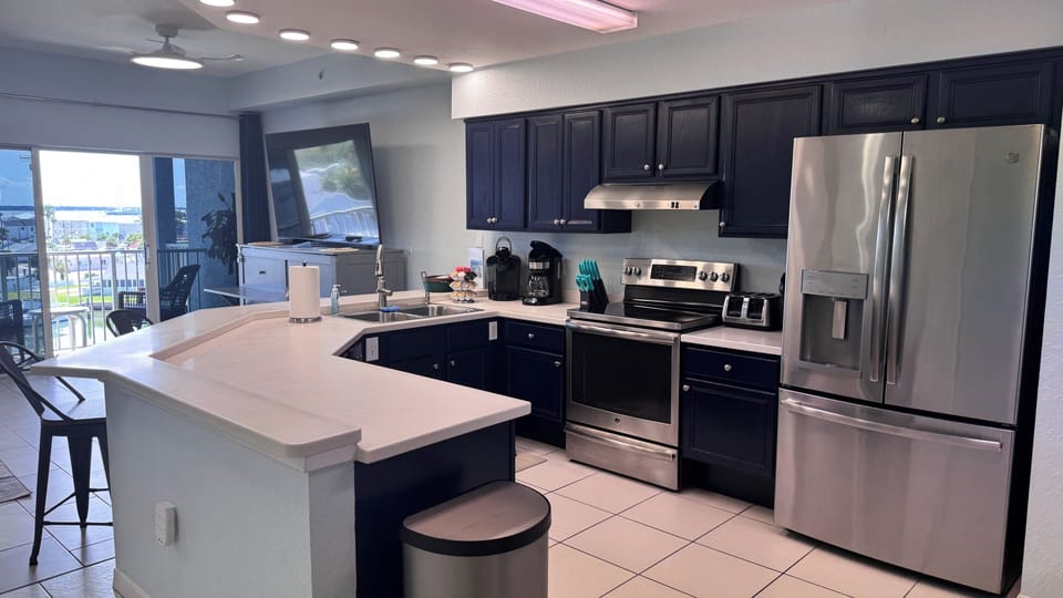 Kitchen with view of large TV that swivels