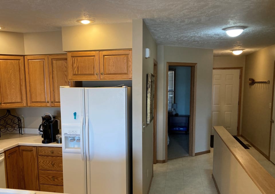 Kitchen and hallway to main entrance and garage