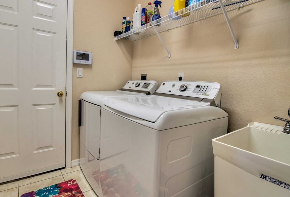 There is a Full Sized Laundry Room Right Off of the Garage