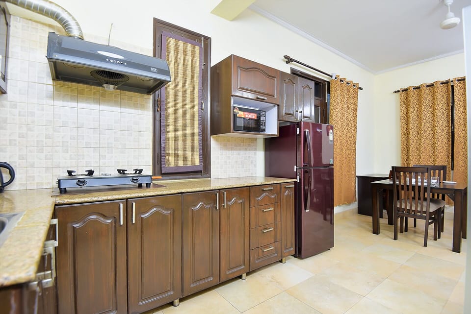 Fully Functional kitchen of Studio Apartment by BedChambers in Sushant Lok.