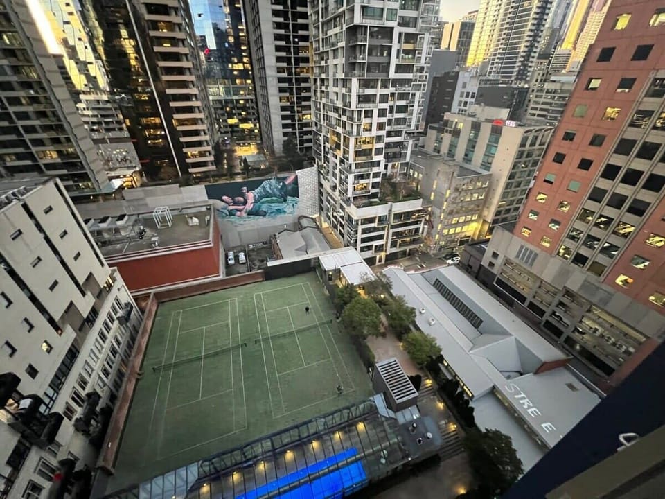Actual view of tennis courts and pool from balcony