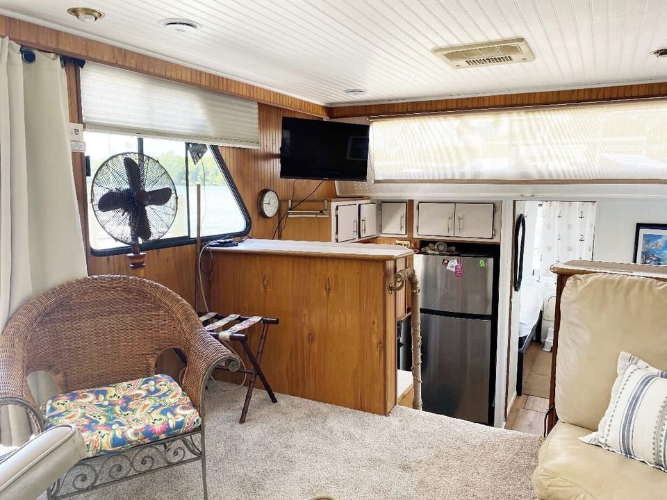Spacious living area ..wrap around leather sofa. Looking down in kitchen/dining