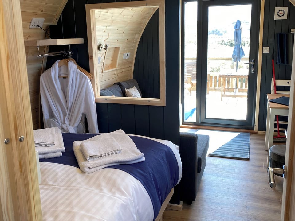 Customers can relax in comfort with the bath robes and slippers provided for their stay | Maggie&rsquo;s Cabin, Oban