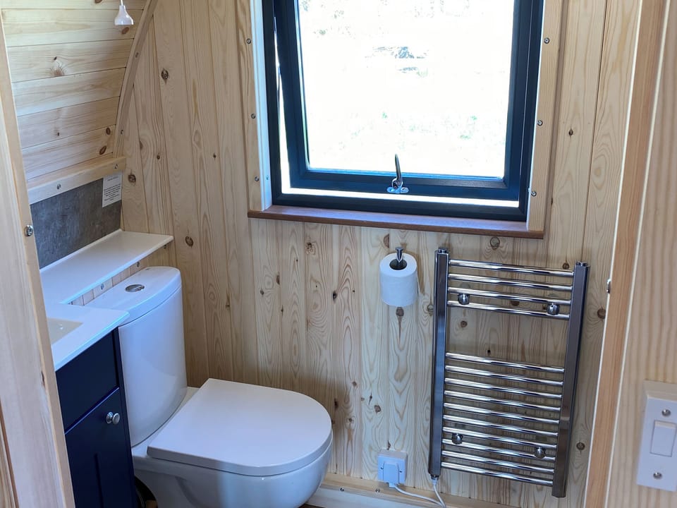 Heated towel rail in the shower room | Maggie&rsquo;s Cabin, Oban