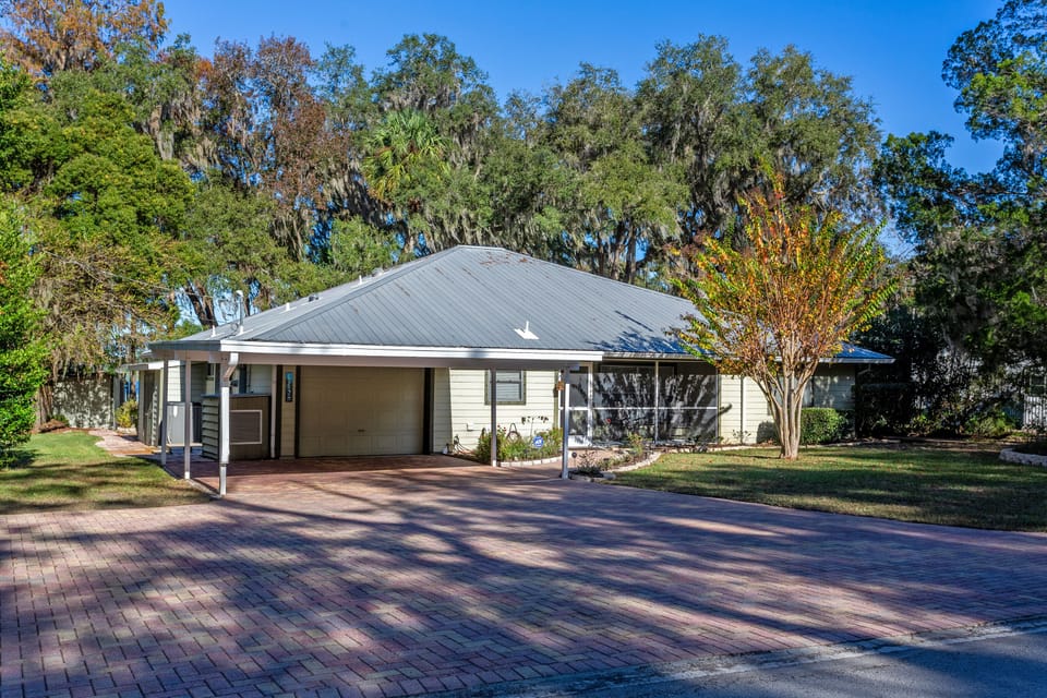 Front of the house with covered carport. Also have room for RV and RV hookup.