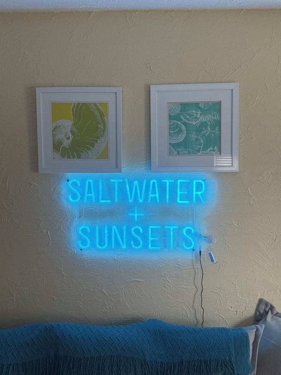 Saltwater and sunsets. The sign is not wrong, both are a minute from the door.
