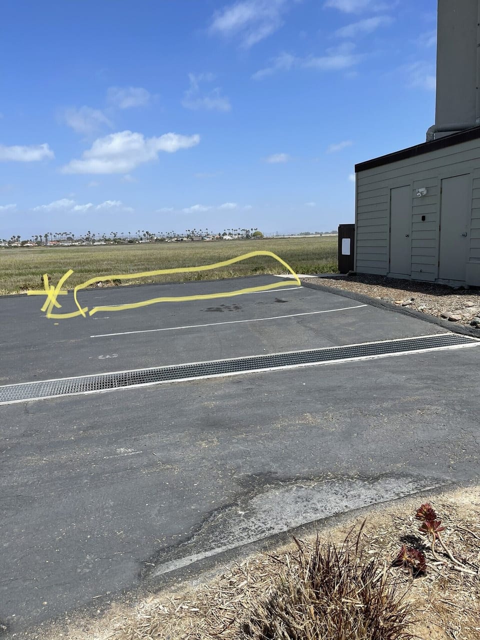 Parking space for condo in yellow. 