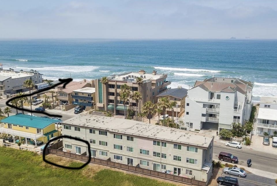 Deck circled and side yard. Short one minute walk to get on the beach. 