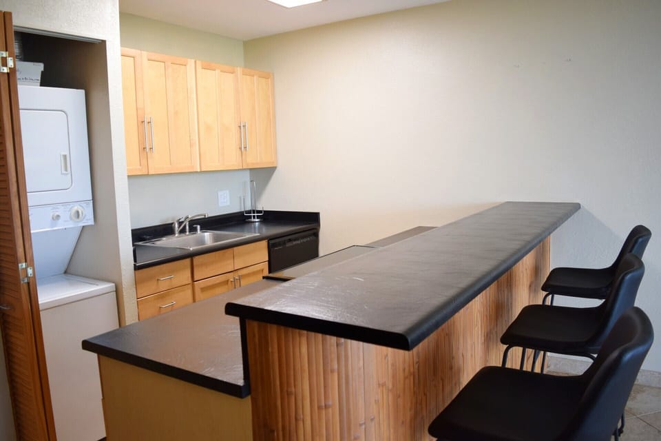 Kitchen with breakfast bar seating for 3