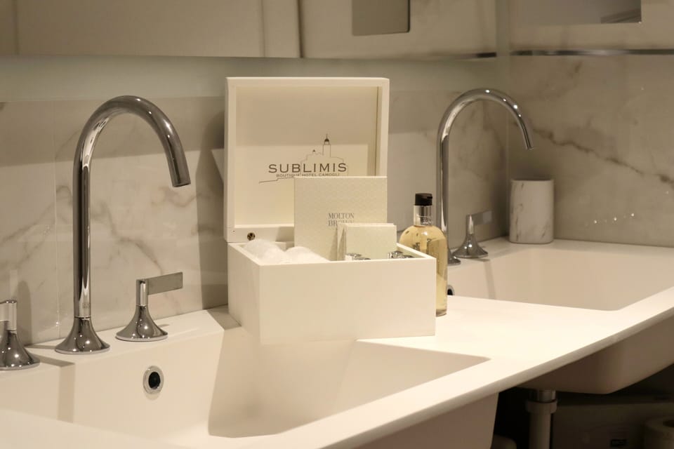 Designer toiletries, hair dryer, bathrobes, slippers