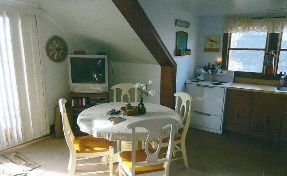 Another view of dining area and kitchen