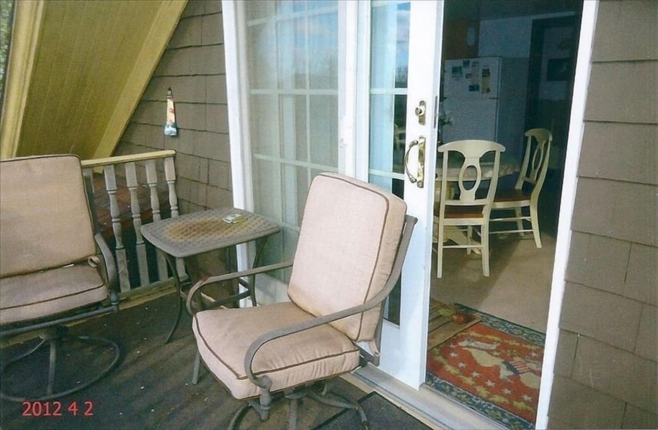 Deck going into apartment overlooking back yard.