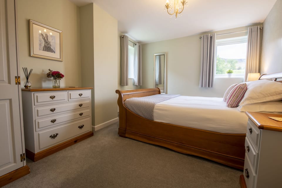 First floor: Master bedroom with king-size bed