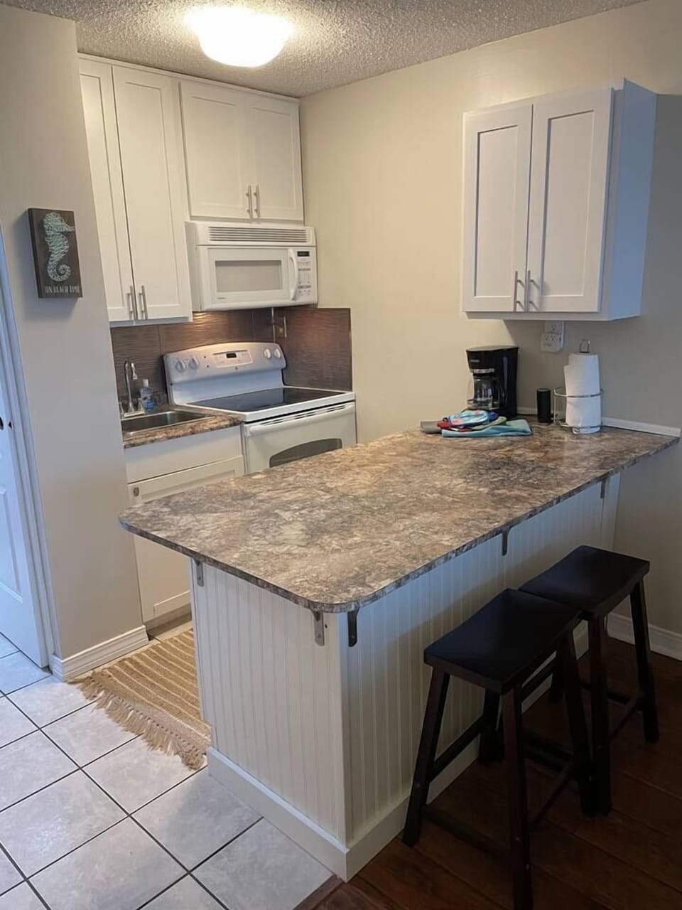 Kitchen bar with two bar stools