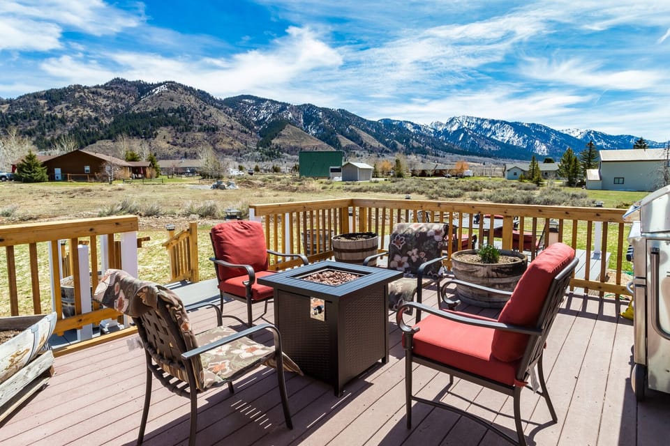 Deck with firepit, barbeque and view of the mountains.