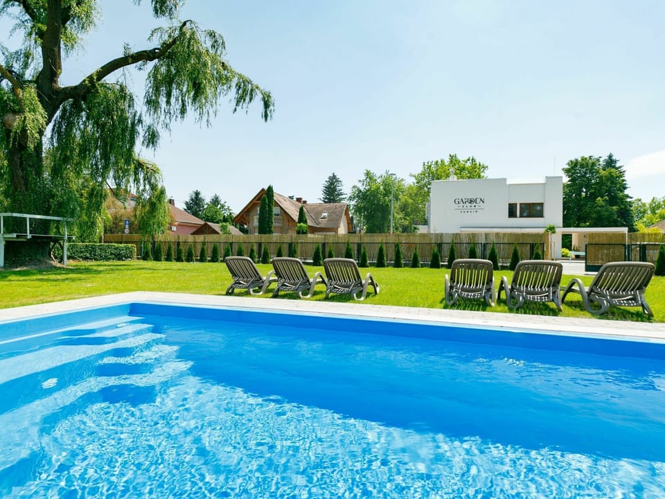 Water, Sky, Plant, Swimming Pool, Property, Building, Tree, Azure, Shade, Outdoor Furniture