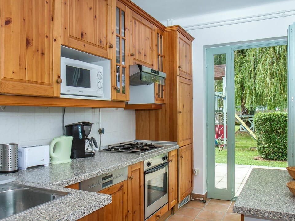 Cabinetry, Property, Kitchen Sink, Furniture, Countertop, Plant, Sink, Kitchen Appliance, Kitchen Stove, Kitchen