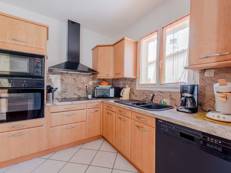 Cabinetry, Countertop, Property, Kitchen Sink, Window, Sink, Kitchen Stove, Kitchen Appliance, Wood, Building