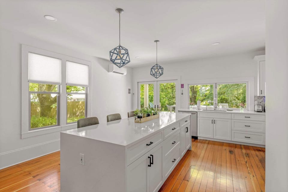 Elegant finishes, designer lighting, and expansive counter space elevate every culinary experience.