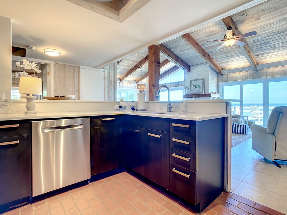 The kitchen opens up to the living and dining area and offers an oceanfront view.