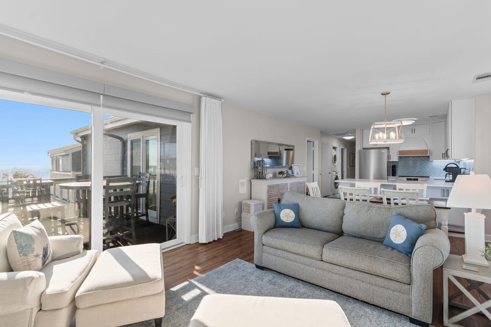 Relax in your bright, airy living space with panoramic views and seamless indoor-outdoor flow to your private balcony.