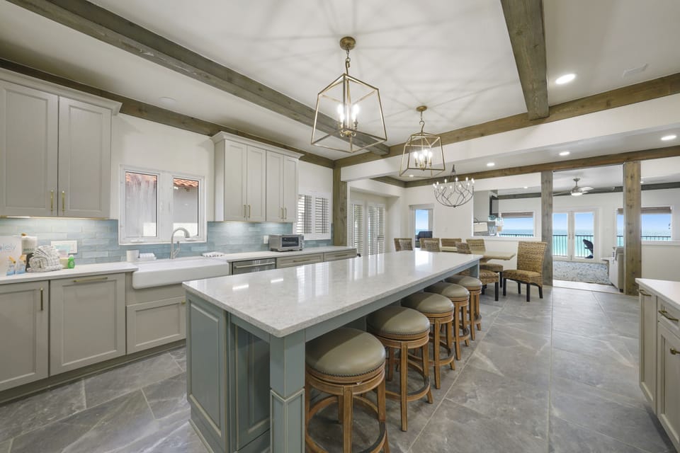 A view of the dining area from the kitchen into the new living area.