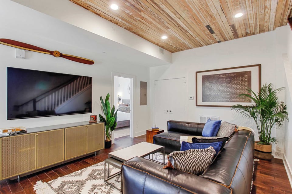 Living Room | Comfortable Seating Area with TV | First Floor of Third Floor Unit