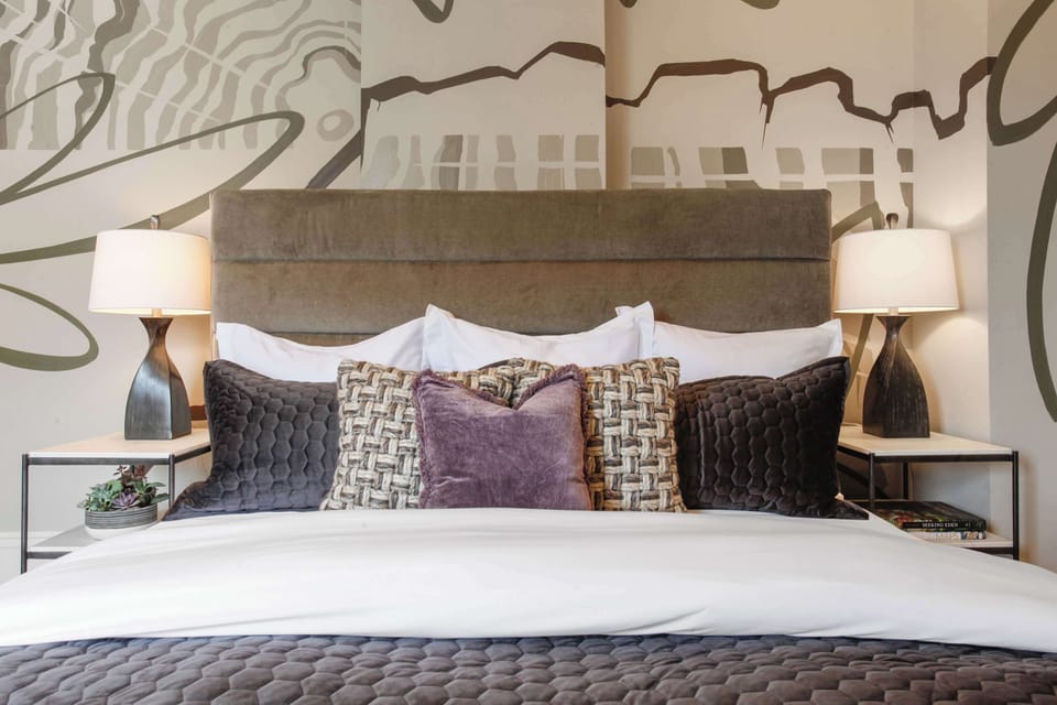  Bedroom 3 | King Bed with Tufted Headboard and Ensuite Bathroom | Fourth Floor of Building — Unit on One Level