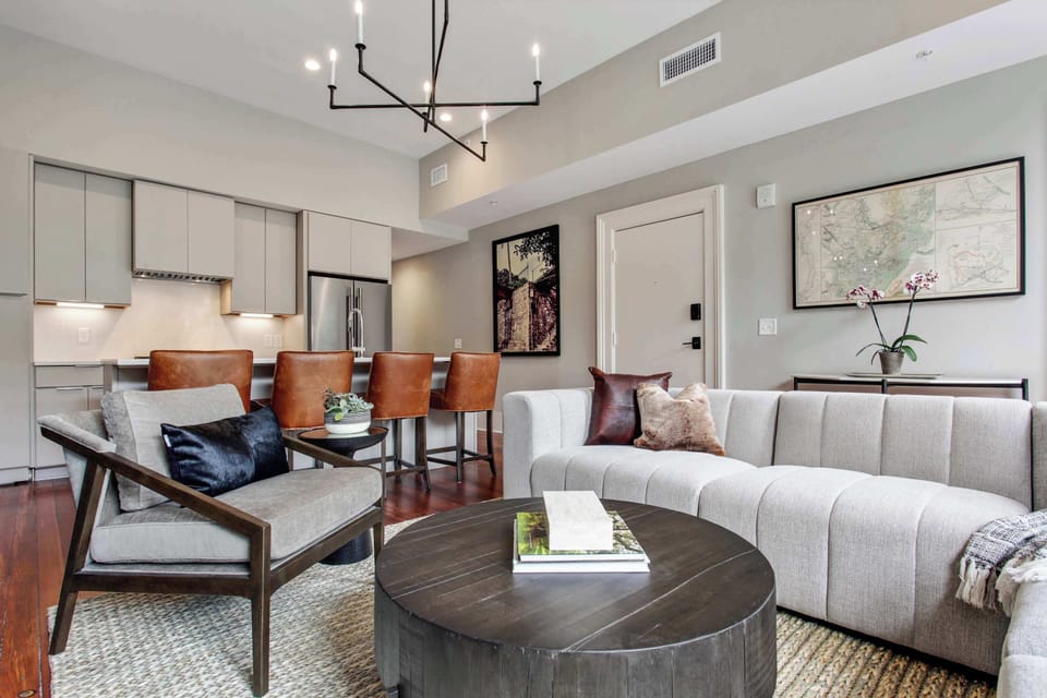 Living Room | Dining and Sitting Area with Chandelier | Third Floor of Building — Unit on One Level