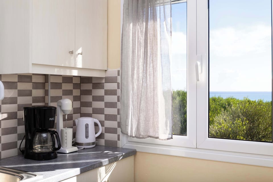 Kitchen Counter with Coffee Maker and Essentials
Kitchen counter featuring a coffee machine and everyday kitchen essentials.
